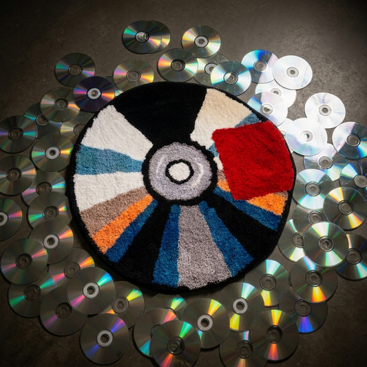 Compact DISK Rug surrounded by CDs